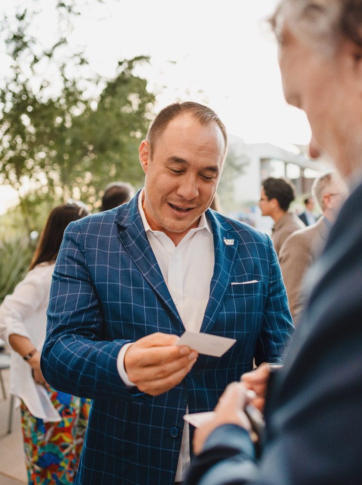 Experts in conversation at outdoor event